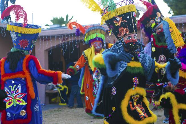 Chinelos, dancers, perform their "Brinco del Chinelo" dance, Tuesday, Jan. 8, 2013. The "Comparza Morelense," a local Las Vegas cultural dance troupe, has been invited to perform at President Obama's inauguration parade on January 21.